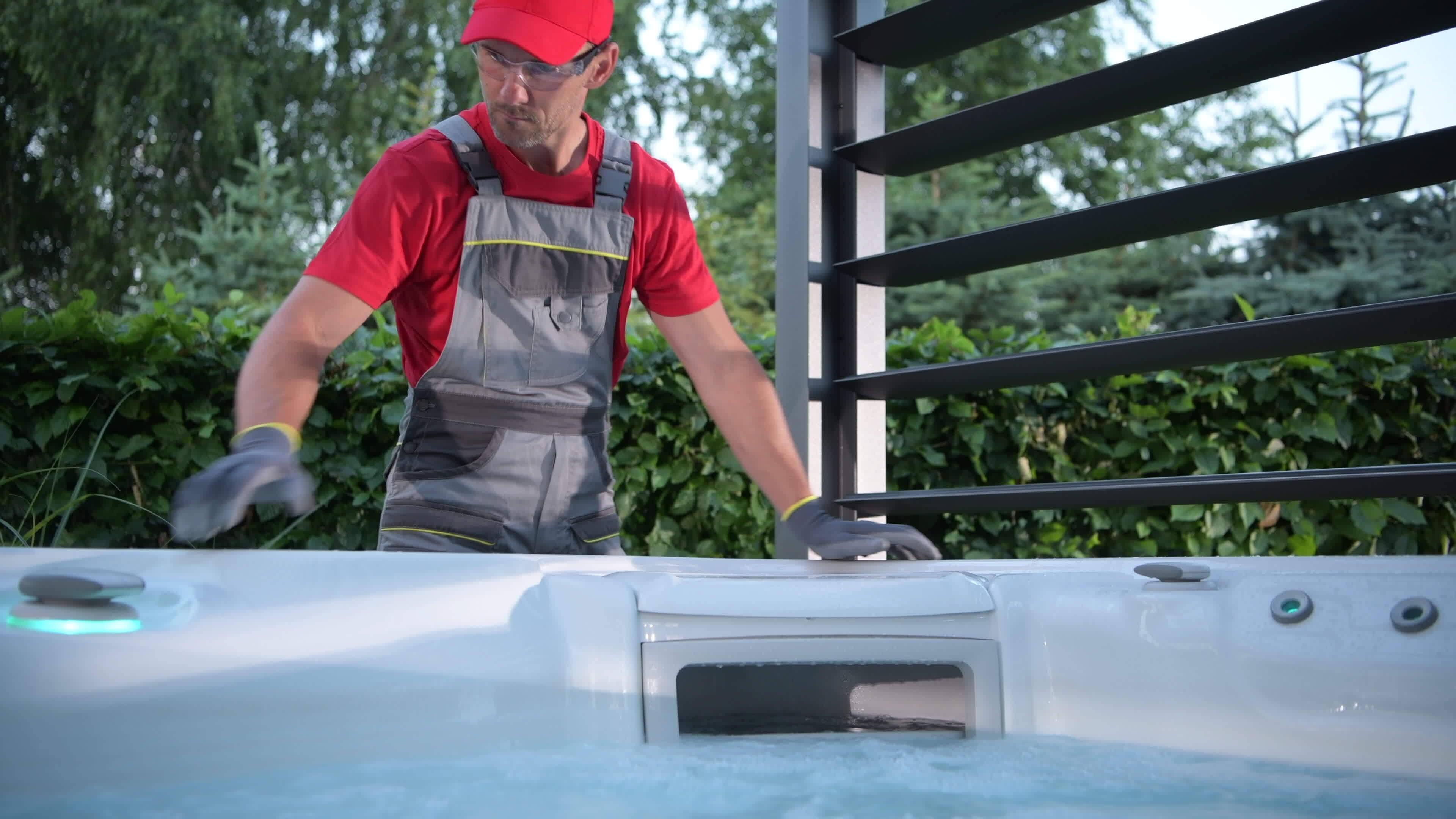 Hot Tub Installer Testing Newly Installed SPA Inside Garden Gazebos