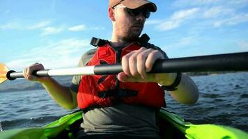 Sportsman in Kayak. Kayaking on the Lake. Men in the Kayak video