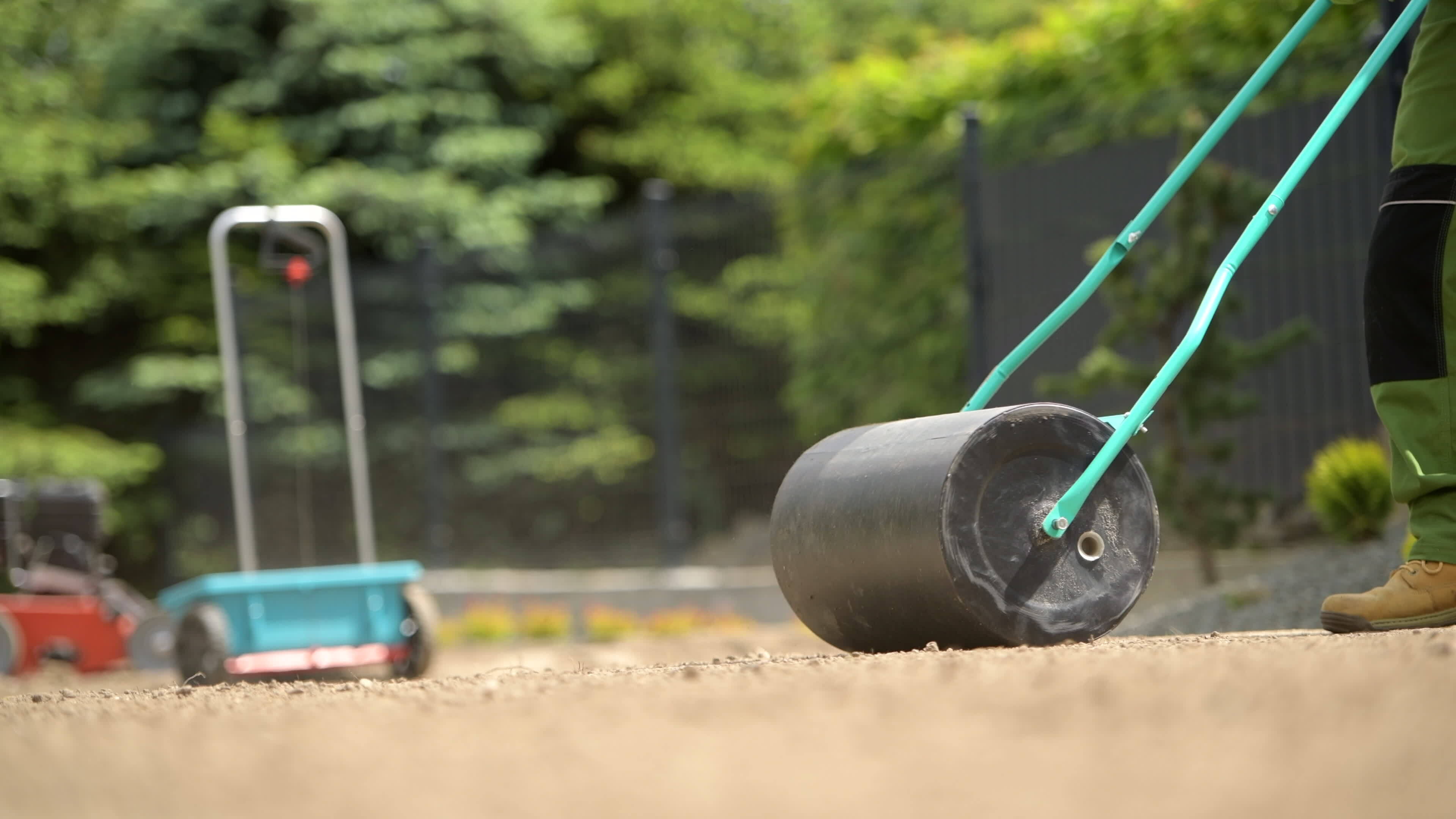 Compacting Soil Using Lawn Roller 24829979 Stock Video at Vecteezy