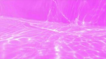 Purple water with ripples on the surface. Defocus blurred transparent pink colored clear calm water surface texture with splashes and bubbles. Water waves with shining pattern texture background. video