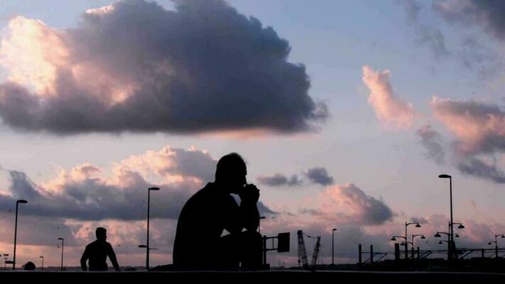 Thinking Man Sitting Alone On Sea Beach feeling alone and sad 5254986 Stock  Photo at Vecteezy