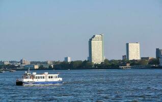 Low Angle view of Central London Buildings and River Thames at Canary Wharf Central London. The Footage Was Captured During Sunset over London City of England UK on June 08, 2023 photo