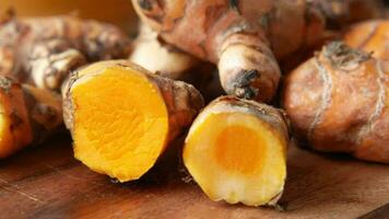 detail shot of turmeric root in bowl on table video