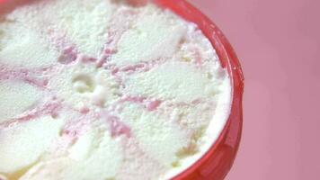 Close up of vanilla flavor ice cream in a container video