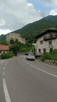 Cars driving through the town center of  Kastelbell - Tschars, Vinschgau, South Tyrol video