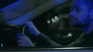 Man sits in a car, upset that he was stopped by the police for a traffic violation video