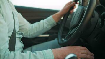 Man is driving a car and stops it close-up video