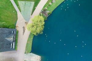 Best Aerial view of Willen Lake and Park During Sunset The Footage Was captured at Milton Keynes City of England UK. The Gorgeous View of Lake Was Captured with Drone's Camera on 11-May-2023 photo