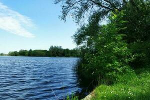 Beautiful Low Angle View of Caldecotte Lake of Milton Keynes England UK. The Footage was Captured on 21-May-2023 During Warm and Sunny day over Great Britain. photo