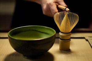 Organic Green Matcha Tea in a Bowl. Close up. . photo
