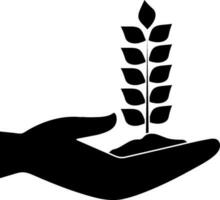 Organic plant icon in hand for growth concept in silhouette style. vector