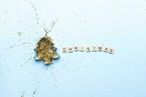 Flat lay christmas. Sequins inside the Christmas tree. Word christmas from wooden letters photo