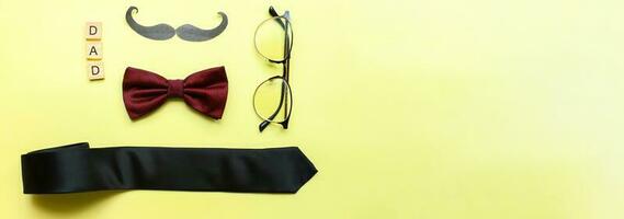 Banner Fathers day card. Flat lay glasses, mustache, bow tie. happy fathers day photo