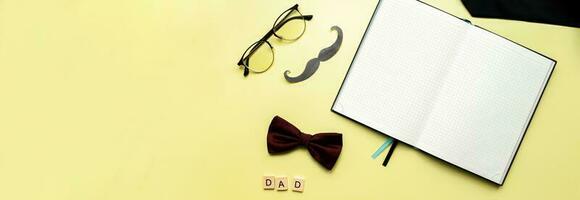 Banner Mockup diary on a yellow background. Flat lay happy fathers day photo