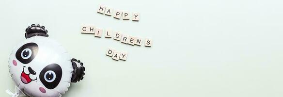 Banner Childrens day. Childrens Day lined with wooden letters. balloon panda photo