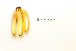 Flatly bananas. The word bananas from wooden letters. Veganism, fruitarianism photo