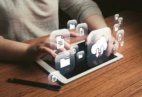 Woman use digital tablet with cloud computing diagram. Cloud technology. Data storage. Networking and internet service concept. photo