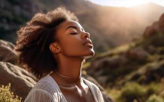 Black woman breaths fresh air on the forest. . photo