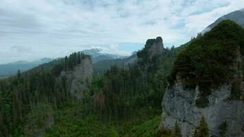 Flying through the clouds, close to the rocks. High Tatras, Slovakia video