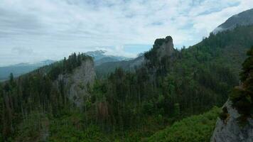 Flying through the clouds, close to the rocks. High Tatras, Slovakia video