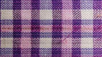 Purple and white checkered fabric pattern. photo