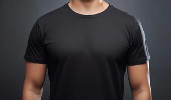 Powerful presence, strong man showcasing black t-shirt mockup on gray background photo