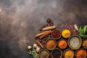 Top view of assorted spices and herbs on stone table copy space photo