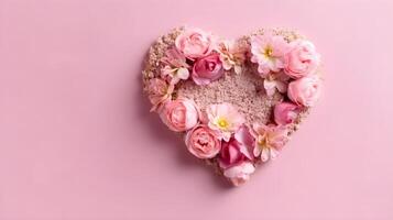 Pink heart and rose petals on a pink background with copy space. photo