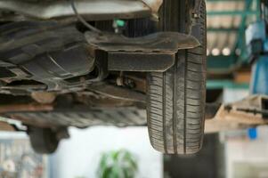 Close-up car wheel garage changing wheels. concept of auto repair and maintenance service. photo