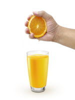 Hand squeezing orange into glass with drink of orange colour, transparent background png