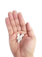 ein Hand voll von Weiß Tabletten im Hand auf ein transparent Hintergrund png