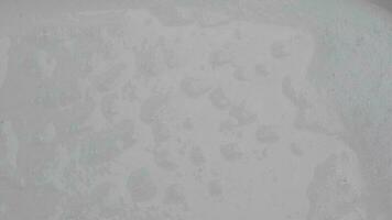 Texture of white soap foam with abstract soap bubbles background. video