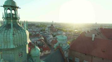 Aerial view of Wawel royal Castle and Cathedral early morning at dawn. Panorama of the city is visible in the background video