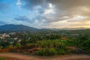 Majestic sunset in the mountain landscape in Dai Binh mountain valley, Vietnam photo