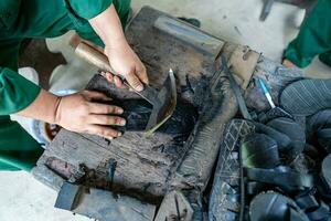 Handmade Rubber Slippers Made From Car Tire in Cu Chi tunnel, Vietnam photo