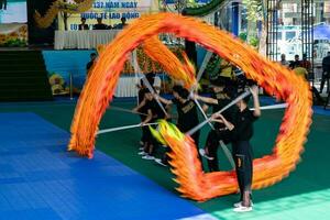 Ho Chi Minh, Viet Nam - 22 April 2023 Dragon dance, celebrate the new year. At the park photo