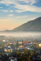 Mountains during dawn. Beautiful natural landscape in the summer time with fog photo