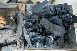 Handmade Rubber Slippers Made From Car Tire in Cu Chi tunnel, Vietnam photo