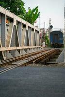 Incredible view of train passing through a narrow street, the Hanoi Old Quarter. Stock photo