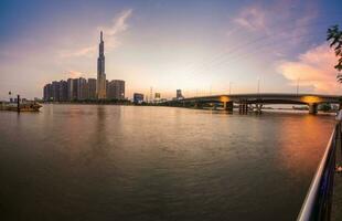 Ho Chi Minh, Viet Nam - 22 April 2023 Sunset at Landmark 81 with warm sunshine photo