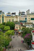 Hanoi, Viet Nam - 13 May 2023 Aerial view of Hoan Kiem Lake  Ho Guom or Sword lake in the center of Hanoi in the fog in the morning. Hoan Kiem Lake is a famous tourist place in Hanoi. Travel concept photo