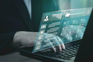 Checklist and assess performance of individuals in business organization with technology of online databases, data on laptops showing analytical and processing results percentages photo
