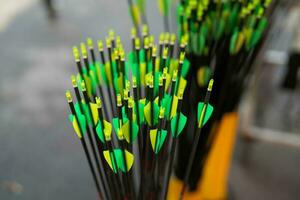 Colorful group of archery arrows shows fletching which are plastic vanes photo