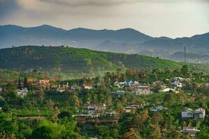 Majestic sunset in the mountain landscape in Dai Binh mountain valley, Vietnam photo