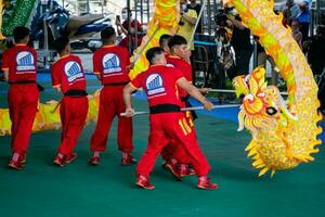 Ho Chi Minh, Viet Nam - 22 April 2023 Dragon dance, celebrate the new year. At the park photo