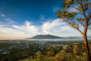 Mountains during dawn. Beautiful natural landscape in the summer time with fog photo