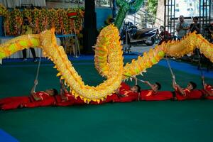 Ho Chi Minh, Viet Nam - 22 April 2023 Dragon dance, celebrate the new year. At the park photo