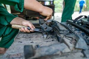 Handmade Rubber Slippers Made From Car Tire in Cu Chi tunnel, Vietnam photo