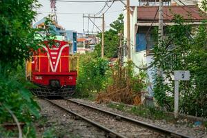 Incredible view of train passing through a narrow street, the Hanoi Old Quarter. Stock photo