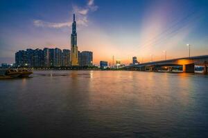 Ho Chi Minh, Viet Nam - 22 April 2023 Sunset at Landmark 81 with warm sunshine photo